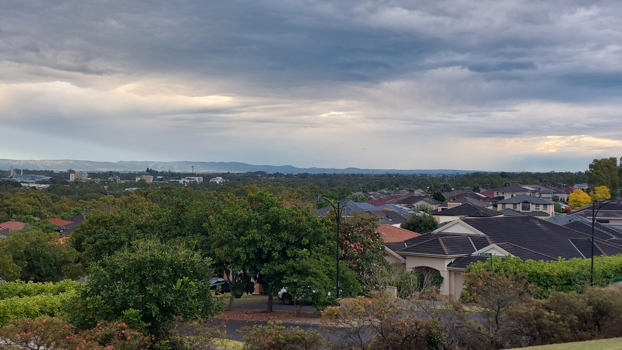 Beaumont Hills, NSW, Suburban rooftops with distant hills in background