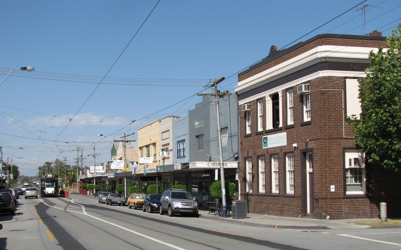 Malvern East, VIC, Street with shops and a historic building