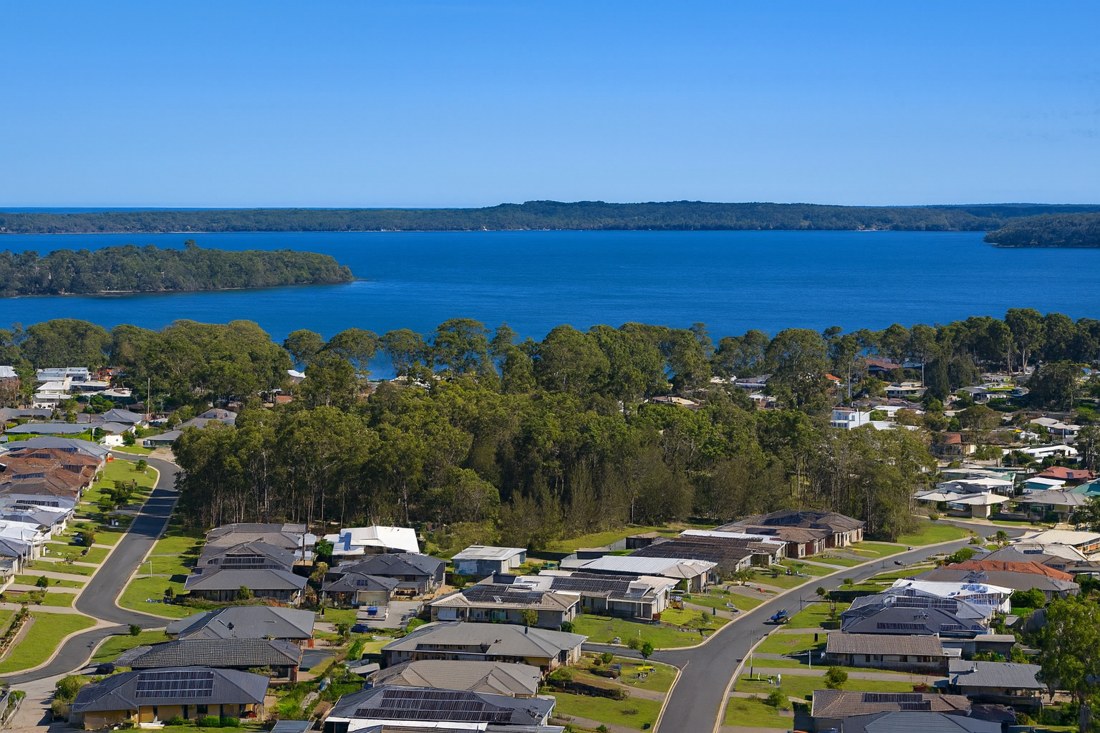 Sanctuary Point, NSW, Houses with trees and water in background